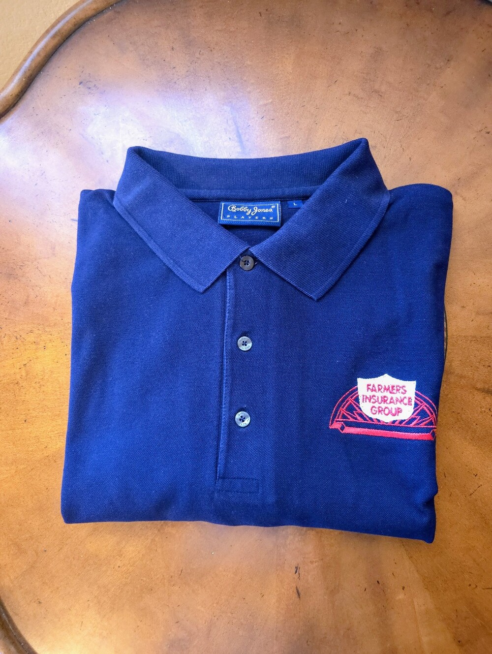 FARMER'S Logo Bobby Jones (L)